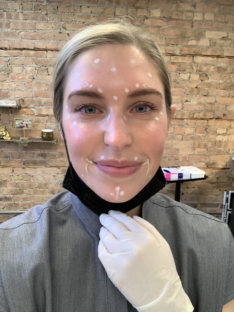 elizabeth russeau using facial skin care product