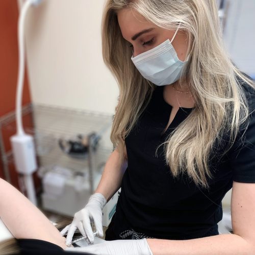 elizabeth russeau administering skin treatment